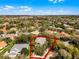 Panoramic aerial view of home and community surrounded by lush landscaping at 1613 Glenwick Dr, Windermere, FL 34786
