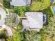 Aerial view of beautiful home with tile roof, screened-in pool and manicured landscaping at 1613 Glenwick Dr, Windermere, FL 34786