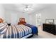 Bedroom with ceiling fan and neutral paint featuring a view into the en suite bathroom at 1613 Glenwick Dr, Windermere, FL 34786