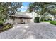 Stately home with a spacious three-car garage and a paved driveway at 1613 Glenwick Dr, Windermere, FL 34786