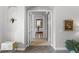 Inviting foyer with arched doorway, decorative accents, and ceramic tile flooring at 1613 Glenwick Dr, Windermere, FL 34786