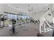 Community gym features exercise bikes, treadmills and weight machines overlooking a lake at 1613 Glenwick Dr, Windermere, FL 34786