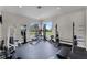 Community gym features weight machines, free weights and mirrors at 1613 Glenwick Dr, Windermere, FL 34786