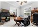Bright home office featuring a large window, stylish desk and a glimpse into the living room at 1613 Glenwick Dr, Windermere, FL 34786