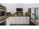 Kitchen with stainless steel appliances, granite countertops, and modern cabinetry at 1613 Glenwick Dr, Windermere, FL 34786
