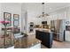 Bright kitchen with white cabinets, stainless steel appliances, a central island, and granite countertops at 1613 Glenwick Dr, Windermere, FL 34786