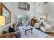 Spacious living room with high ceilings, comfortable seating, and sliding glass doors to the backyard at 1613 Glenwick Dr, Windermere, FL 34786