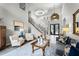 Bright living room with high ceilings, staircase, and comfortable seating arrangements at 1613 Glenwick Dr, Windermere, FL 34786