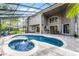 Gorgeous outdoor pool and spa with screened enclosure and outdoor patio dining set at 1613 Glenwick Dr, Windermere, FL 34786