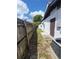View of backyard featuring a wooden fence, shed, and the home's exterior wall at 1616 Ferndell Rd, Orlando, FL 32808