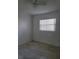 This bedroom has a ceiling fan, a window with blinds, and tile flooring at 1616 Ferndell Rd, Orlando, FL 32808