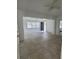 Bright living room with neutral paint, ceiling fan, and tile floors provides an open space for entertaining at 1616 Ferndell Rd, Orlando, FL 32808