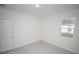 Clean bedroom with window, neutral walls and flooring with an open entry at 16815 Sw 41St Avenue Rd, Ocala, FL 34473