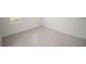 Bright bedroom with tile floors, white walls, and a large window at 16815 Sw 41St Avenue Rd, Ocala, FL 34473