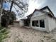 Back of construction site; incomplete two-story home with exposed framing and visible construction materials at 1702 Arbor Park Dr, Winter Park, FL 32789