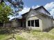 Side view of an unfinished two-story home under construction with installed windows and a blue sky at 1702 Arbor Park Dr, Winter Park, FL 32789
