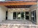 The unfinished patio has a sliding glass door offering bright natural light at 1702 Arbor Park Dr, Winter Park, FL 32789