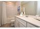 Clean bathroom with white vanity, modern fixtures, and shower-tub combo at 17667 Saw Palmetto, Clermont, FL 34714