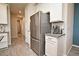 Modern kitchen featuring stainless steel appliances, a tile backsplash, and a sleek refrigerator at 17667 Saw Palmetto, Clermont, FL 34714