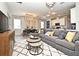 Bright and open living space featuring modern design, a large sofa, and stylish dining area at 17667 Saw Palmetto, Clermont, FL 34714