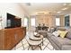 Spacious open-concept living area with modern furniture, dining space, and a relaxed atmosphere at 17667 Saw Palmetto, Clermont, FL 34714