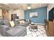 Open-concept living room features a plush sectional sofa, modern accents, and stylish decor at 17667 Saw Palmetto, Clermont, FL 34714