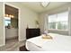 Bright main bedroom with a view to an en-suite bathroom and modern decor at 17667 Saw Palmetto, Clermont, FL 34714