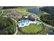 Aerial view of a community clubhouse with a large pool, playground, and green space, perfect for recreation and relaxation at 17667 Saw Palmetto, Clermont, FL 34714
