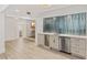 Modern wet bar with stylish backsplash, ample counter space, and easy access to other living areas at 1832 Magnolia Ave, Winter Park, FL 32789
