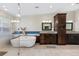 Luxurious bathroom featuring soaking tub, glass shower, granite counters, and custom cabinetry at 1832 Magnolia Ave, Winter Park, FL 32789