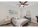 Comfortable bedroom with large windows, ceiling fan, bedside table, and ample natural light at 1832 Magnolia Ave, Winter Park, FL 32789