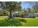 Charming single-story home with a well-manicured lawn and mature shade tree offering curb appeal at 1832 Magnolia Ave, Winter Park, FL 32789