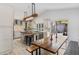 Modern kitchen featuring an island, stainless steel appliances, and a dining area with backyard view at 1832 Magnolia Ave, Winter Park, FL 32789