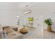 Bright living room with stylish decor, wood flooring, modern lighting, and a comfortable sectional sofa at 1832 Magnolia Ave, Winter Park, FL 32789