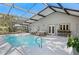 A beautiful, screened in pool area with ample seating for entertaining in the Florida sun at 1832 Magnolia Ave, Winter Park, FL 32789