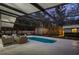 A relaxing screened in pool area with outdoor seating; perfect for enjoying Florida evenings at 1832 Magnolia Ave, Winter Park, FL 32789