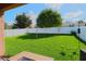Overlooking a backyard featuring manicured lawn, patio furniture, and a white privacy fence at 1862 Great Falls Way, Orlando, FL 32824