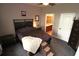 Comfortable bedroom features neutral walls, a queen bed, and a connected bathroom at 1862 Great Falls Way, Orlando, FL 32824