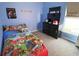 Brightly colored bedroom with a Paw Patrol theme and natural light at 1862 Great Falls Way, Orlando, FL 32824