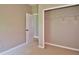 An empty bedroom with a closet and doorway at 1862 Great Falls Way, Orlando, FL 32824