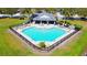Aerial view of community pool offering a relaxing oasis with lounge chairs and covered seating area at 1862 Great Falls Way, Orlando, FL 32824