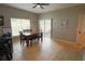 Bright dining area with a sliding glass door and a wooden dining set at 1862 Great Falls Way, Orlando, FL 32824