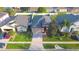 Aerial view shows this home's curb appeal with its driveway and landscaping at 1862 Great Falls Way, Orlando, FL 32824