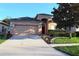 Charming single-Gathering home with landscaped front yard and attached two-car garage at 1862 Great Falls Way, Orlando, FL 32824