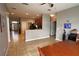 Open-concept kitchen with updated appliances seamlessly flows into the dining area at 1862 Great Falls Way, Orlando, FL 32824