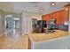 Well-lit kitchen area with bar and stainless steel appliances at 1862 Great Falls Way, Orlando, FL 32824