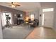 Inviting living room featuring plush seating, a cozy fireplace, and ample natural light at 1862 Great Falls Way, Orlando, FL 32824