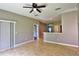 Open-concept living space with tile floors and a ceiling fan at 1862 Great Falls Way, Orlando, FL 32824