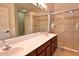 Bathroom with double sinks and glass enclosed shower at 1862 Great Falls Way, Orlando, FL 32824