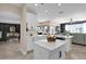 Bright white kitchen with a center island, offering a modern design with ample counter space at 2020 Imperial Eagle Pl, Kissimmee, FL 34746